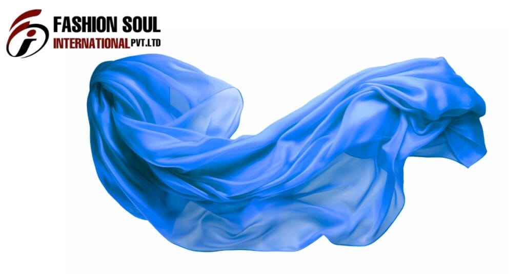 A flowing blue scarf billows in the air against a white background, with the “Fashion Soul International Pvt. Ltd” logo in the top-left corner.