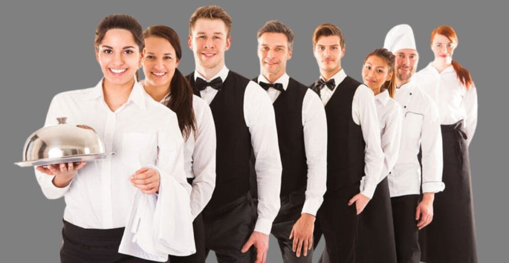 A waiter trying on a tailored blazer that fits perfectly at the shoulders and waist.