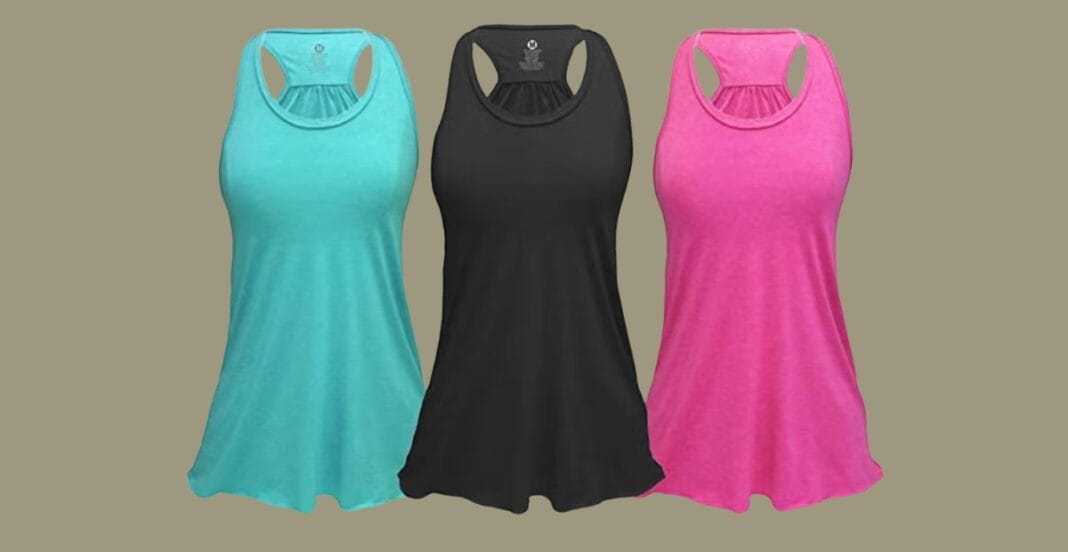 Model wearing a supportive plus-size exercise top during a workout, showcasing breathable fabric, moisture-wicking material, and a flattering fit suitable for active workouts.