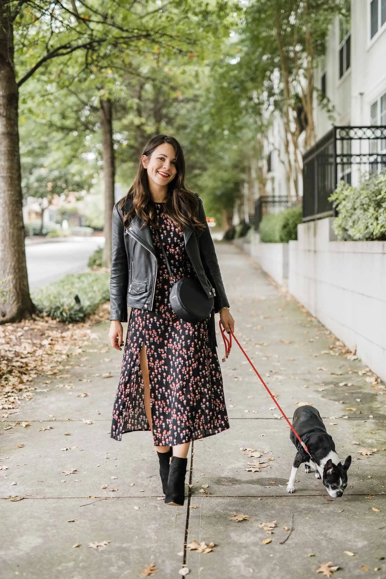 Layered women’s casual midi dress with a denim jacket and ankle boots, ideal for fall smart-casual styling.