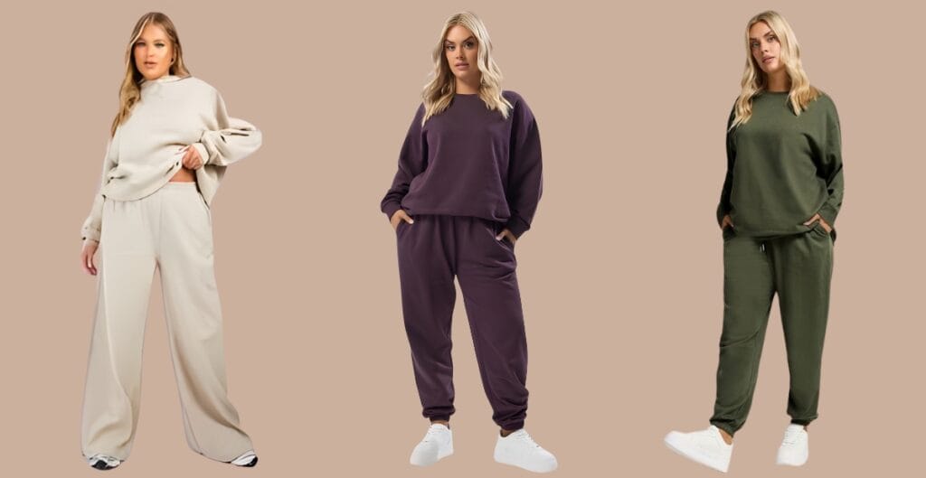 Plus-size model in a soft gray jogger set with a matching zip hoodie, posing casually indoors.