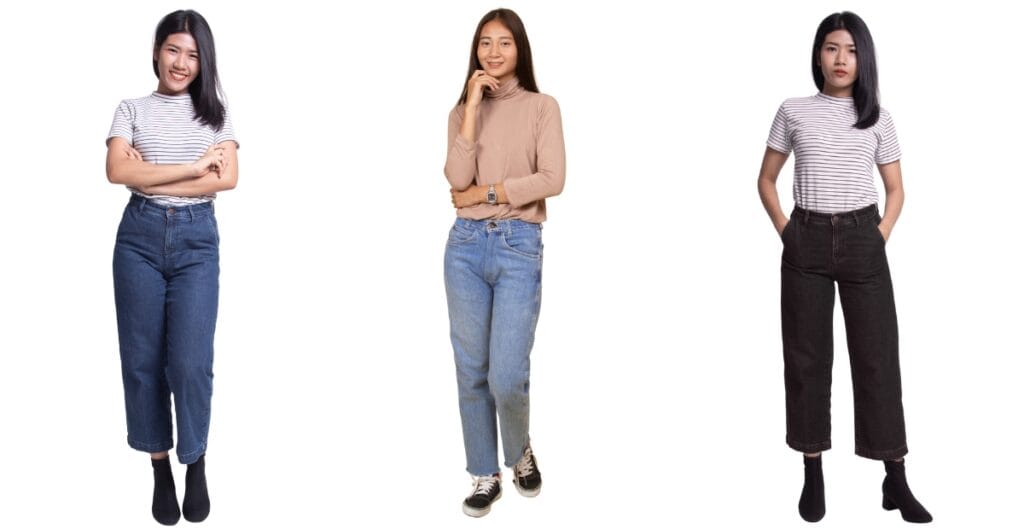 A woman in casual striped shirt and high-waisted jeans, ideal clothes for short-waisted women to elongate the torso
