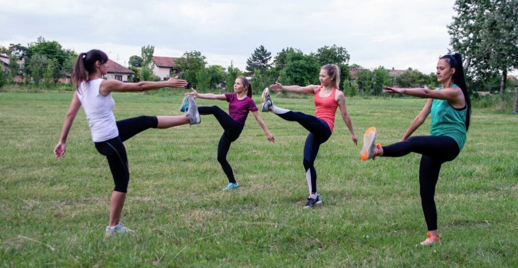 Females in leggings engaging in outdoor fitness activities with athletic wear