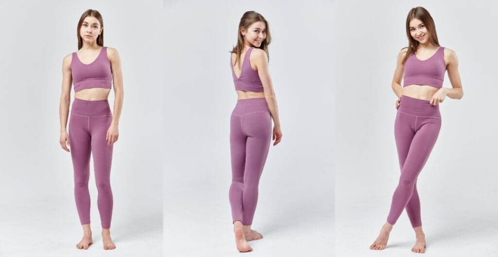 A woman posing in a full-body shot wearing purple gym leggings for ladies, showcasing the leggings' fit and design
