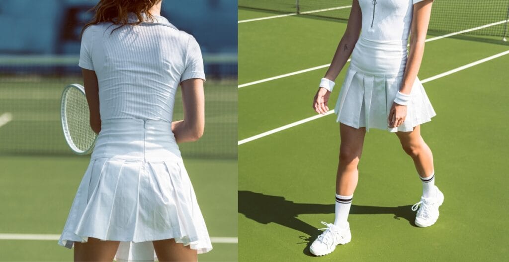 Woman wearing a white tennis skirt on the court, showing sporty style
