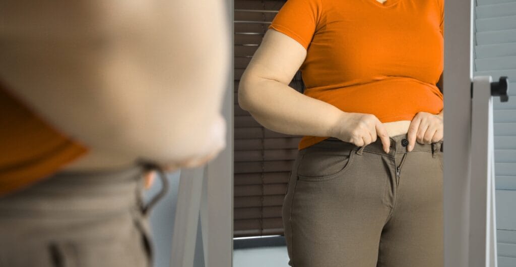 Close-up view of plus size leggings with pockets in neutral tones