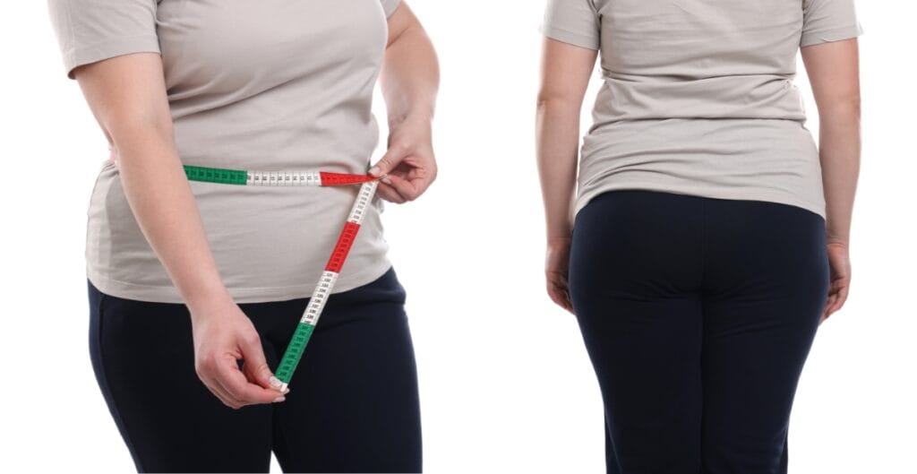 Woman wearing black plus size workout tights showing back and side fit