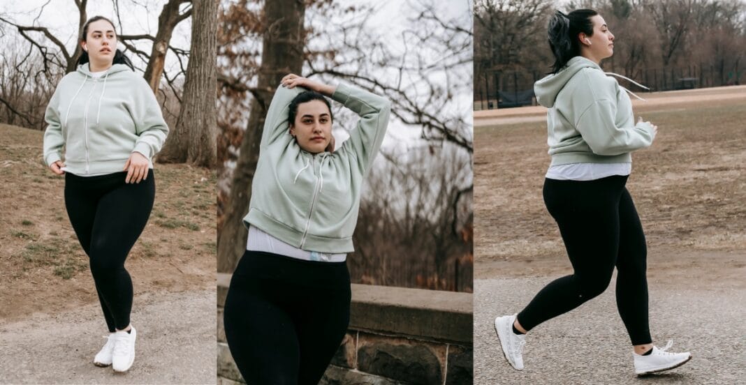 Plus size women jogging outdoors in black workout tights