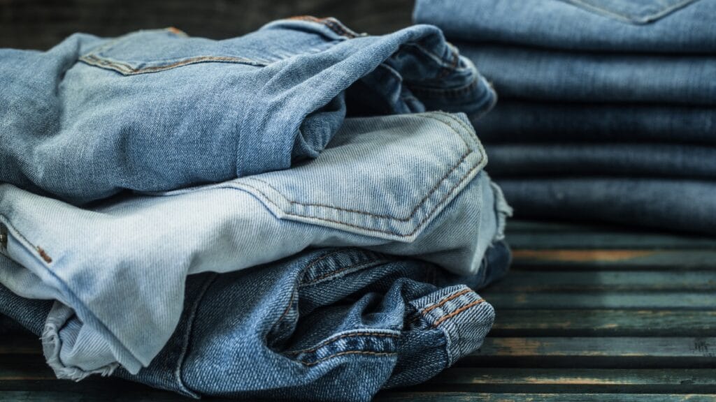 A collection of denim size 28 jeans in different washes and cuts for versatile styling