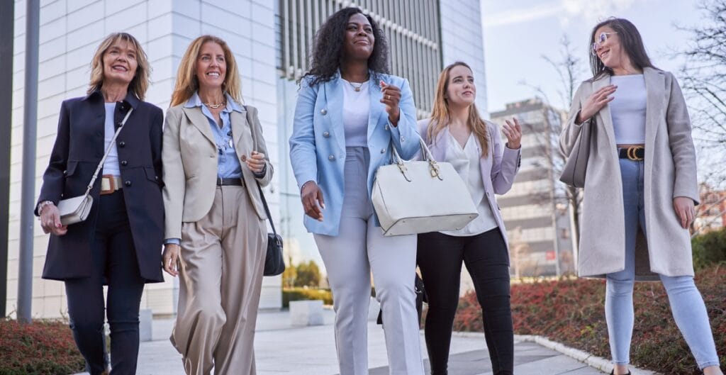 Women in female formal pants walking together, showcasing modern office wear