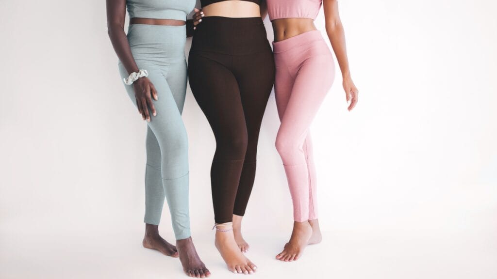 Three women wearing pastel non-ribbed seamless leggings highlighting diverse fits and modern athleisure style
