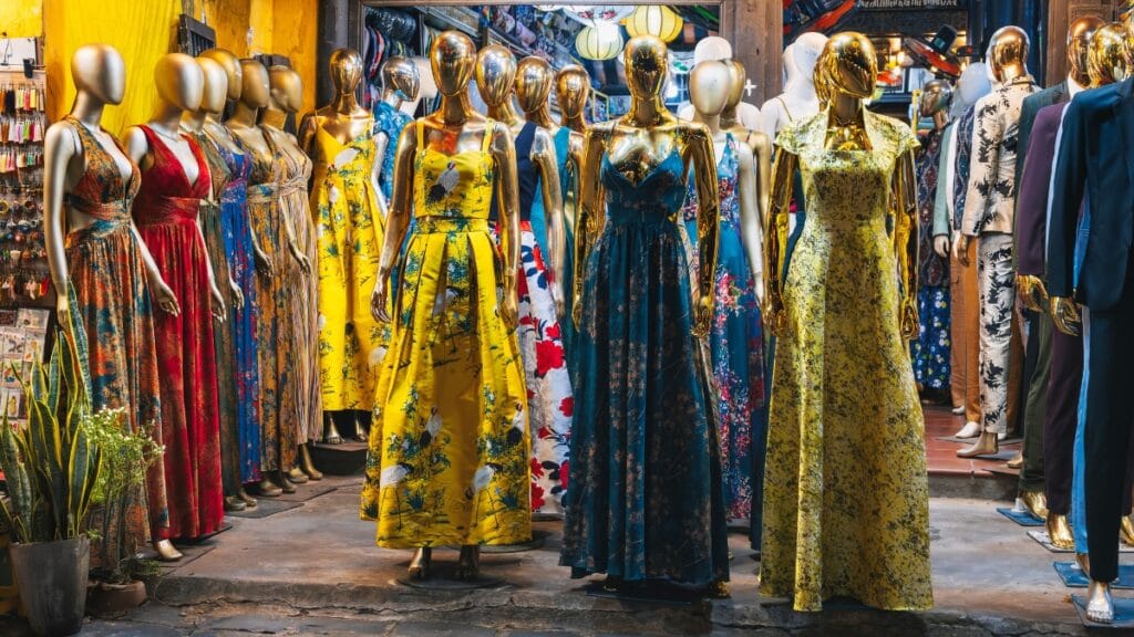 Colorful and stylish collection of sexy midi dresses displayed in a boutique