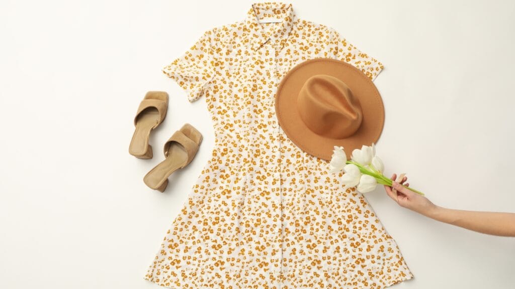 Floral short sleeve midi dress casual with tan sandals and a hat, styled for summer