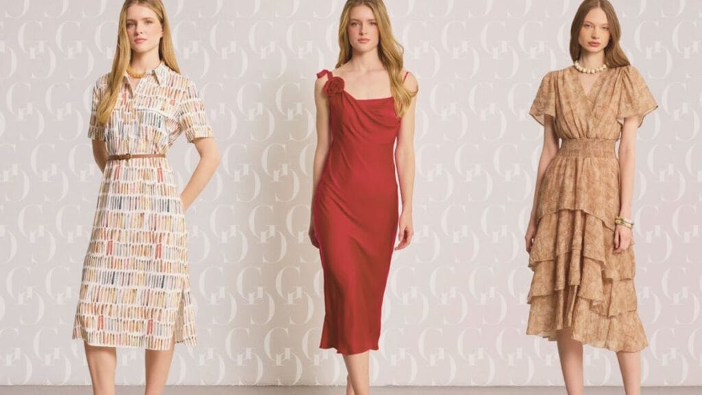 Three women wearing different stylish dresses, each showcasing unique designs, including a patterned shirt dress, a red one-shoulder dress, and a tiered beige dress.