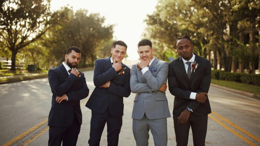 Dressy suits for wedding: Group of groomsmen in stylish wedding suits
