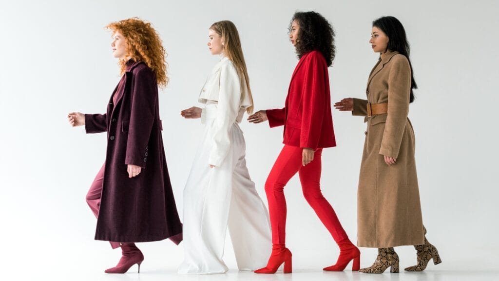 Fashion attire female: diverse models showcasing stylish winter coats in vibrant colors