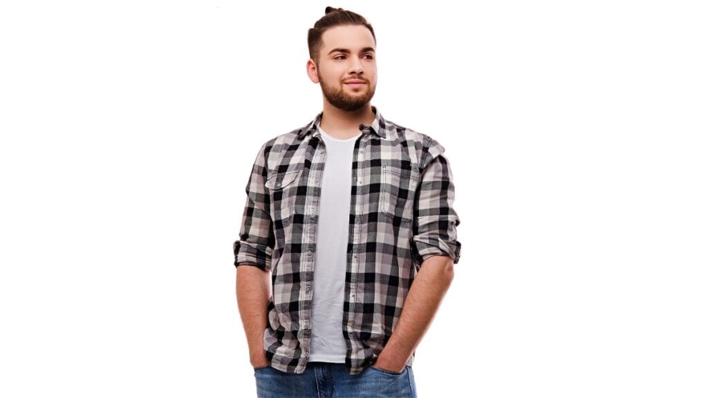 Man wearing a black and white flannel shirt big and tall with rolled sleeves