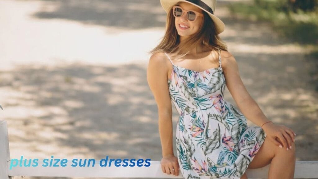 "Plus-size woman wearing a floral sun dress, sunglasses, and a hat, sitting on a bench outdoors."
