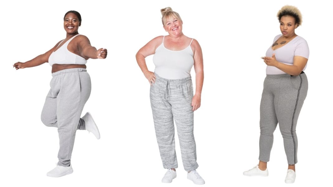 Plus size women wearing comfortable grey track pants, showing confidence and joy.