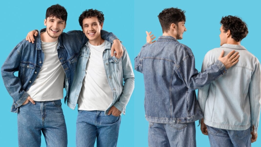 Two individuals wearing stylish tall denim jackets in different washes, posing together in front of a colorful background