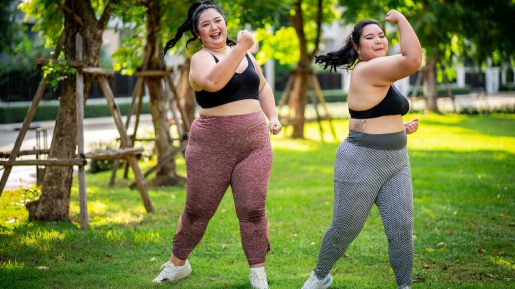 Two women exercising outdoors in fashionable womens plus size joggers