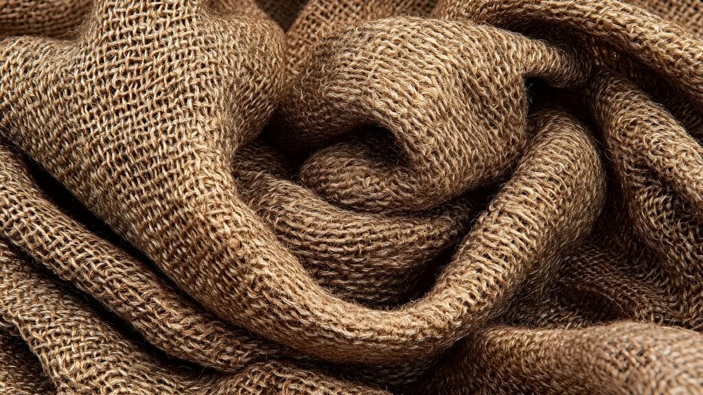 Close-up of coarse fabric with rough texture, showing natural fibers