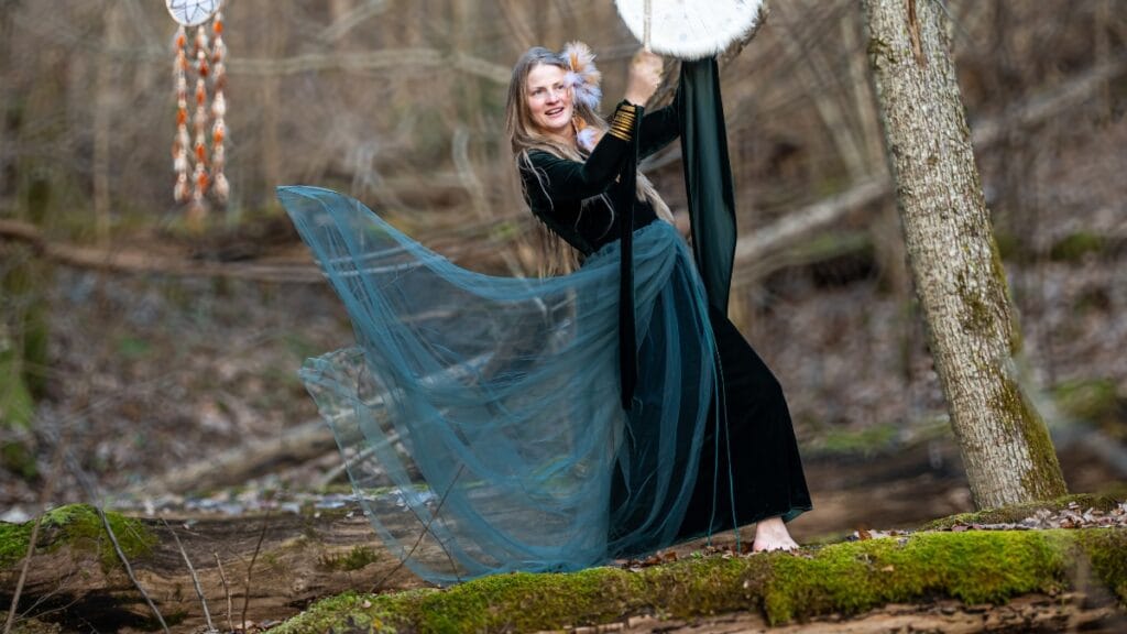 Woman in a flowing dress outdoors, embracing the natural beauty with dress spanks for a perfect silhouette