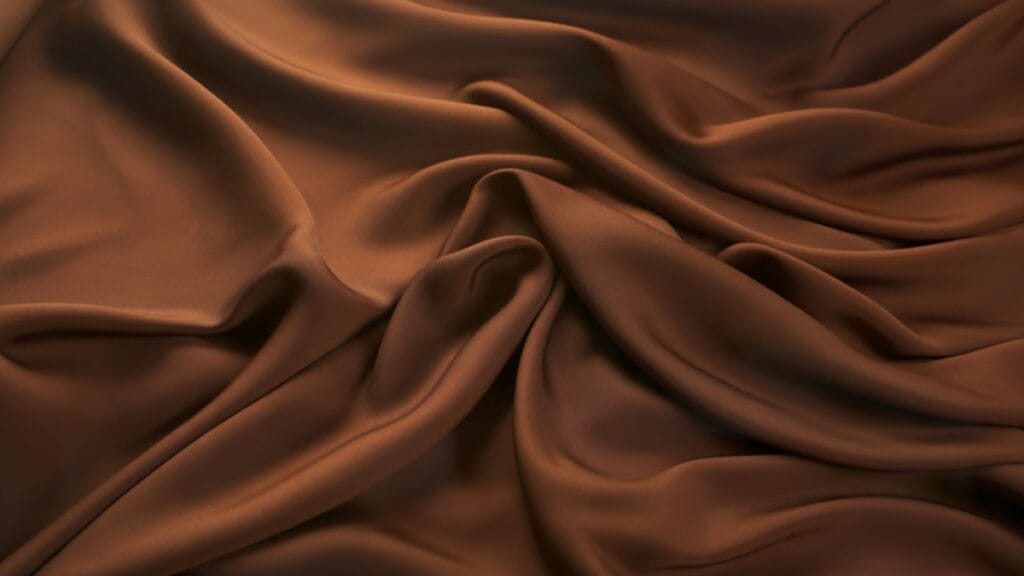 Smooth and glossy brown fade-resistant fabric draped elegantly