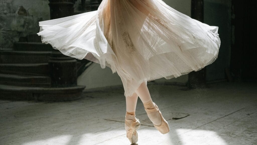 Ballet dancer spinning in a delicate tulle skirt showcasing fabric movement