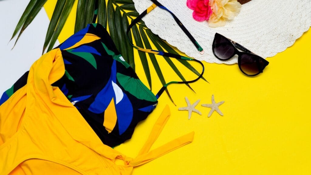 Swim trunk fabric with a bold tropical design and accessories