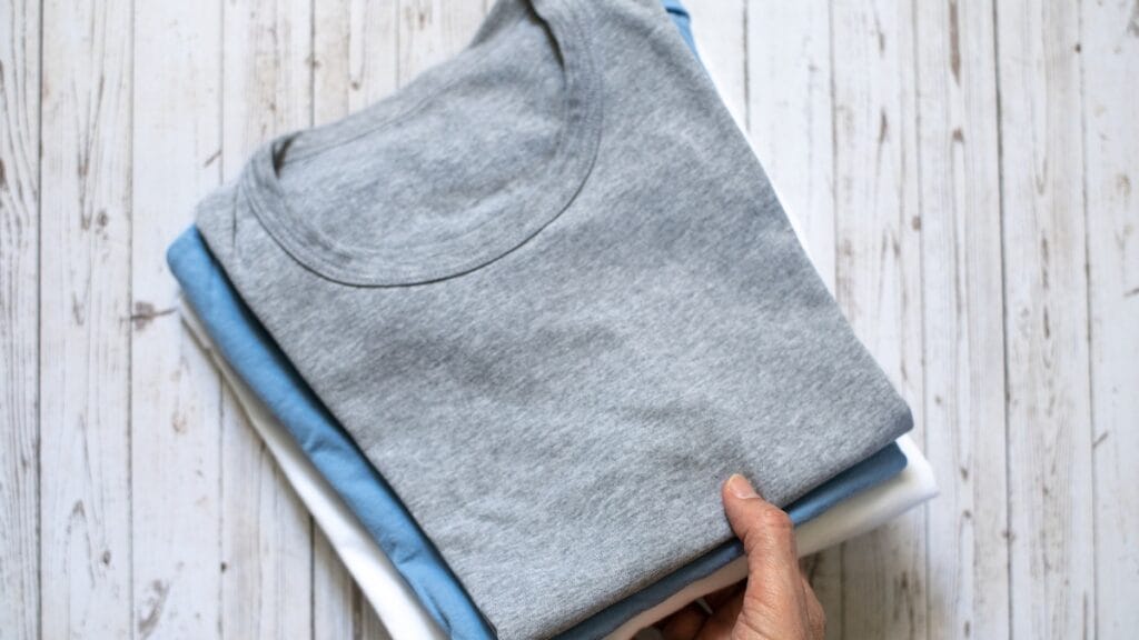 Folded sweatshirts made from soft fabric, highlighting different colors and textures