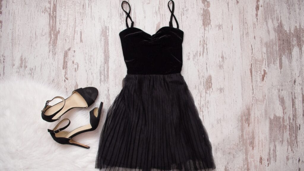 What is a jumper dress? Chic black velvet jumper dress with pleated skirt and heels