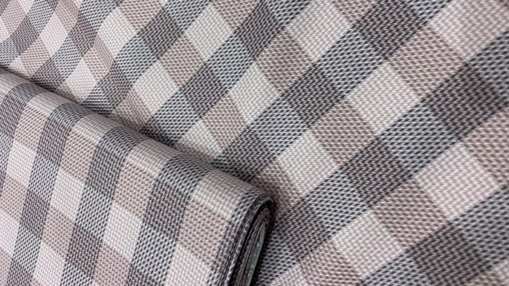 Close-up of a sustainable fabric with a plant-based dye, symbolizing paid fabric emerging from the rise of sustainable fashion.