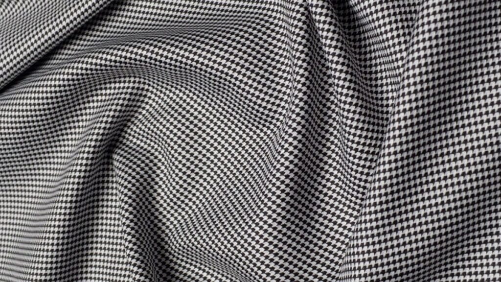 "Concept illustration of a Virtual Chassis Fabric weaving digital and textile technology to create seamless, scalable textile networks."