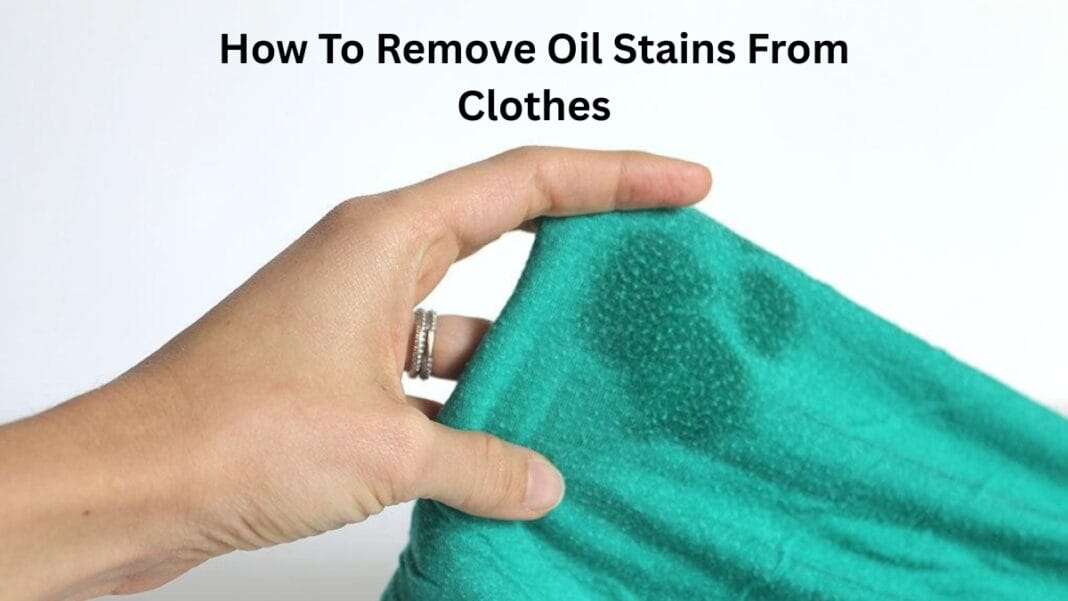 Hand holding up a green fabric while showing how to remove an oil stain from clothes.