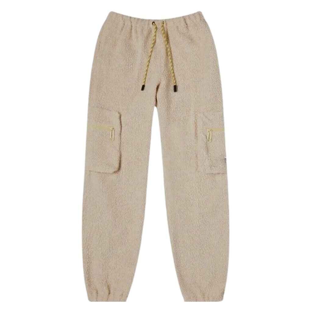 A pair of cozy, light gray wool joggers featuring a relaxed fit, elastic waistband, and tapered cuffs, laid out on a soft, neutral background