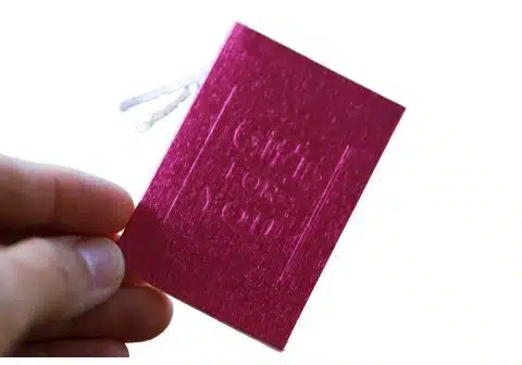 custom embossed and debossed hangtags for custom clothing brands.