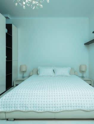 White color Quilt Cover on a bed.