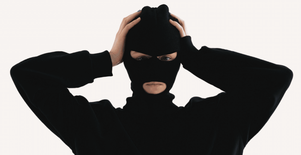 A women wearing a black Ski mask that clearly explaining what is a balaclava.