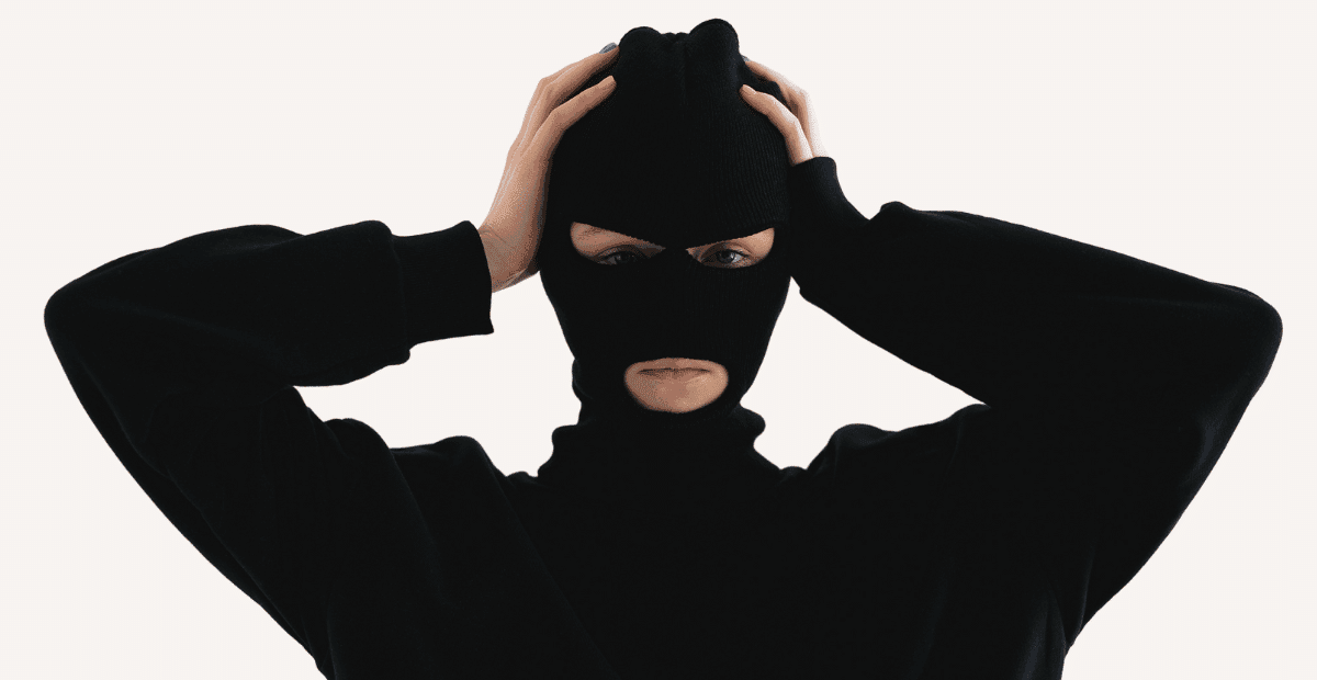 A women wearing a black Ski mask that clearly explaining what is a balaclava.