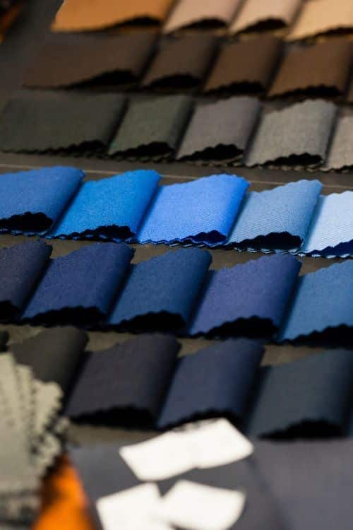 Fabric options including organic cotton, polyester blends, wool, and spandex blends for fashion wear in France