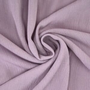 "Close-up of regular viscose fabric highlighting its silky texture, lightweight feel, and versatile drape."