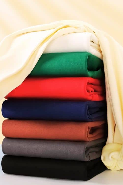 Fabric options like cotton, fleece, and polyester for custom hoodies.