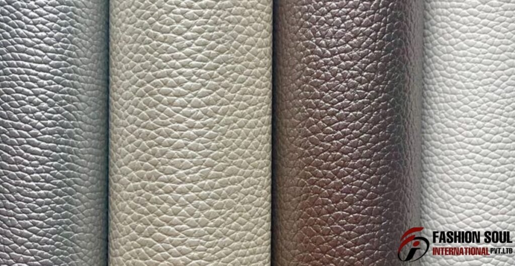 A close-up of four rolls of textured leather-like material in silver, light beige, dark brown, and white. Polyurethane Leather