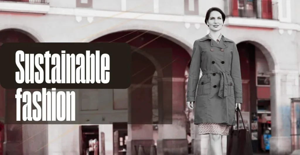 A woman wearing a gray trench coat over a patterned dress stands in a city square, promoting "Sustainable Fashion." The background features architecture with columns and red accents, while the image is edited to black and white except for vibrant elements of the environment. trench coat s the perfect