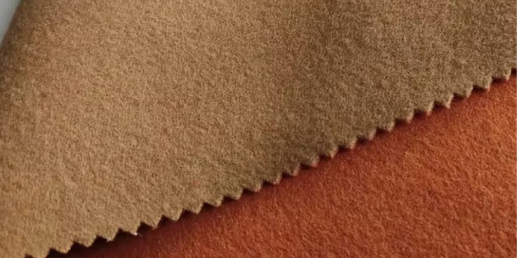 Soft and warm camel wool fabric, showcasing its natural texture and luxurious appeal, ideal for comfort and style.