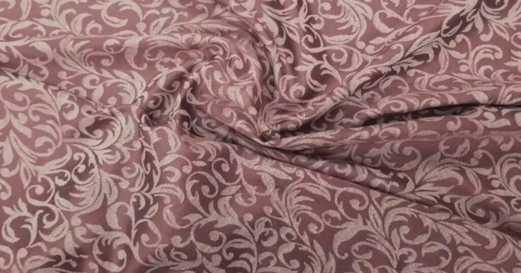 Elegant jacquard fabric with intricate woven patterns, showcasing a luxurious and stylish texture.
