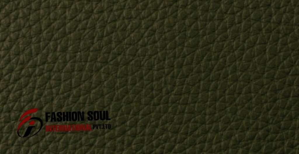 Close-up of bonded leather material with a textured surface in a dark green shade.