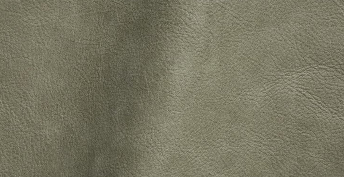 Close-up of textured olive green nubuck leather.