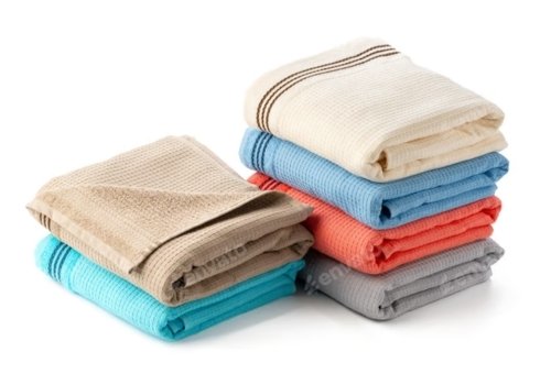 Stack of colorful flat towels in various shades, including beige, blue, coral, turquoise, and gray. Smart & safely